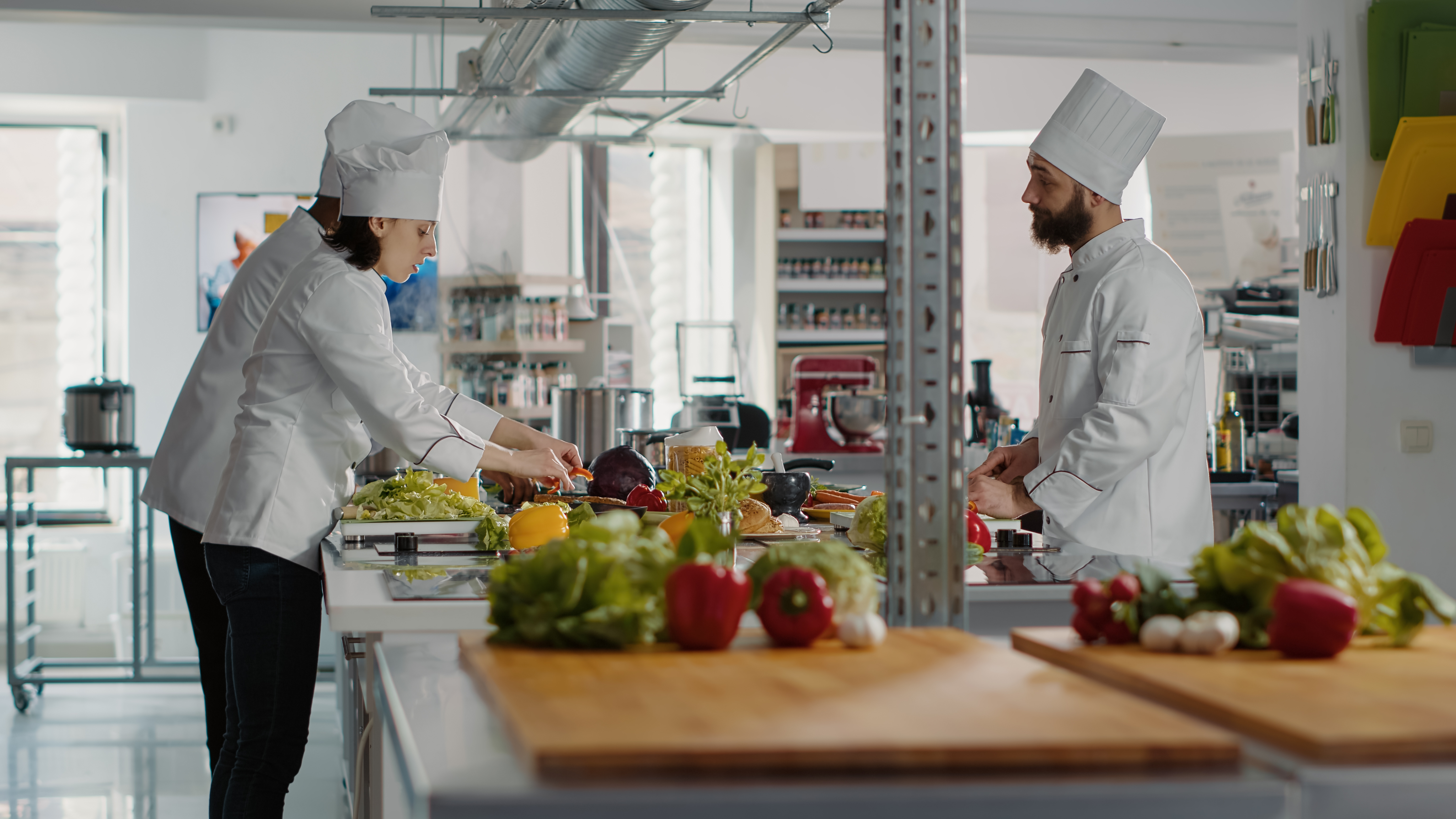 Commercial kitchen staff preparing food, representing operational visibility and distribution control for a leading FMCG conglomerate.